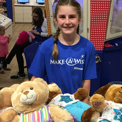 Girl standing in front of bears