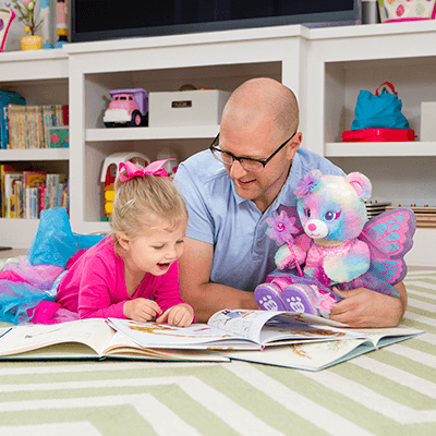 child and adult reading together – Build-A-Bear Foundation