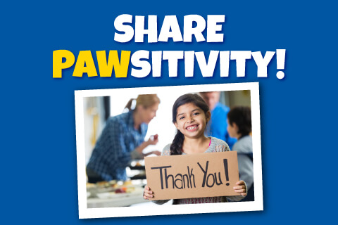 Share Pawsitivity - Child holding thank you sign