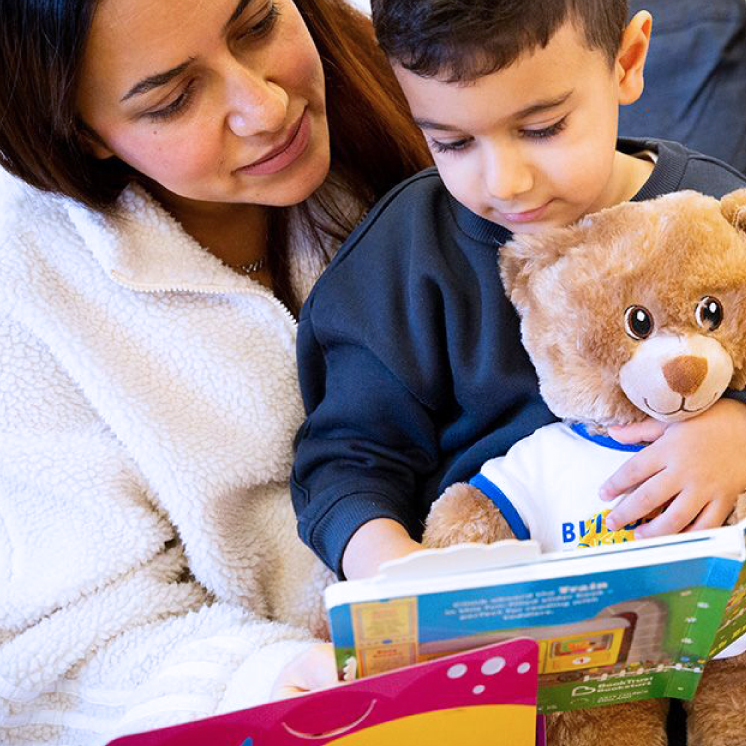woman and child reading a book