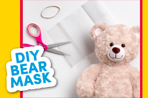 Bear on blank paper with scissors