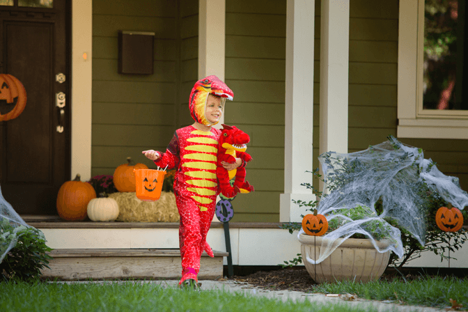 child in a dinosaur costume