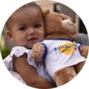 Build-A-Bear child holding bear