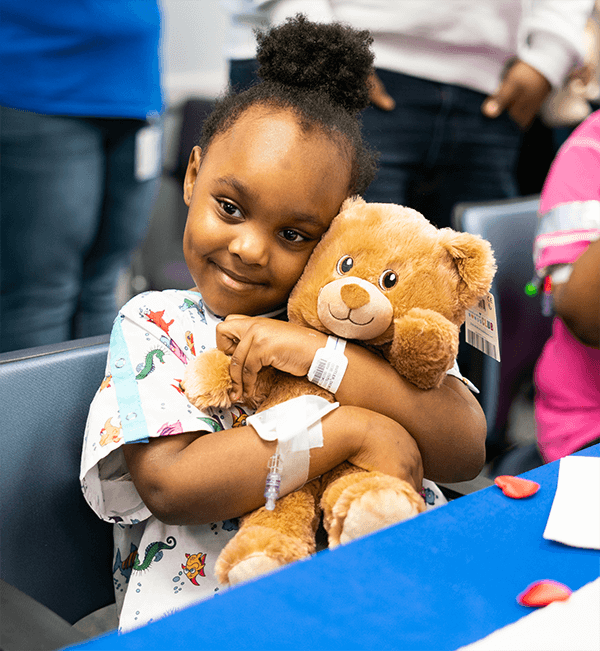 child hugging bear – Build-A-Bear Foundation